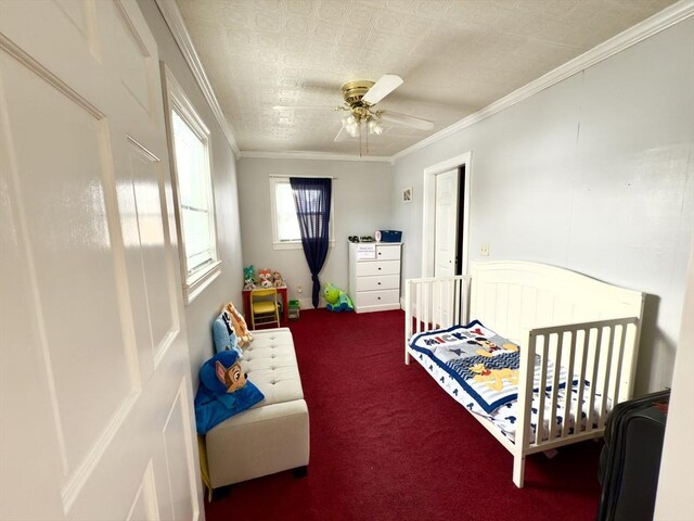 bedroom featuring dark colored carpet, a ceiling fan, and crown molding