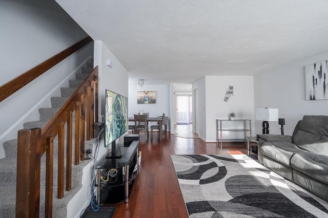 living room featuring dark wood-type flooring