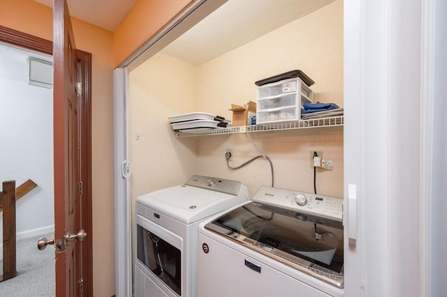 laundry room with carpet and washer and dryer