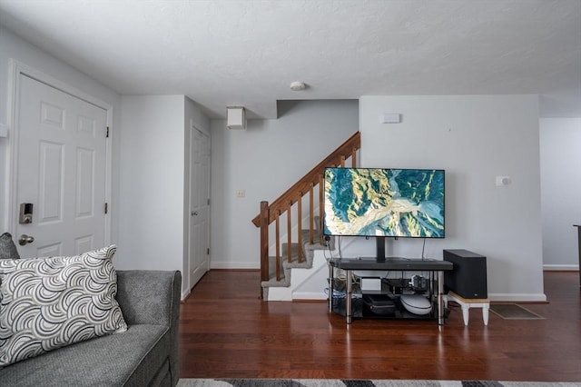 living room with dark hardwood / wood-style floors