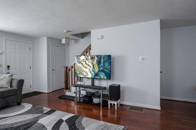 living room with dark hardwood / wood-style flooring