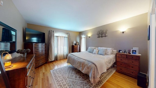 bedroom featuring light wood-style flooring