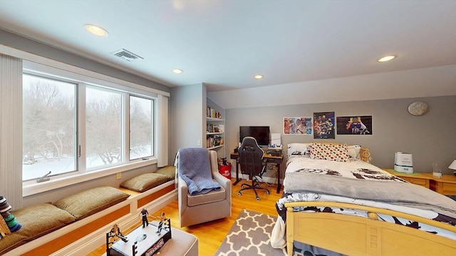 bedroom with light wood-style floors, recessed lighting, and a desk
