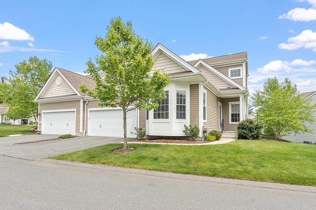 123 Skyline Dr Unit 123, Acton, MA 01720 - view of front of home with asphalt driveway, a front yard, and an attached garage