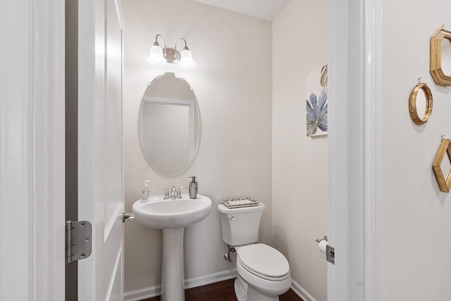 123 Skyline Dr Unit 123, Acton, MA 01720 - bathroom featuring toilet, baseboards, and a sink