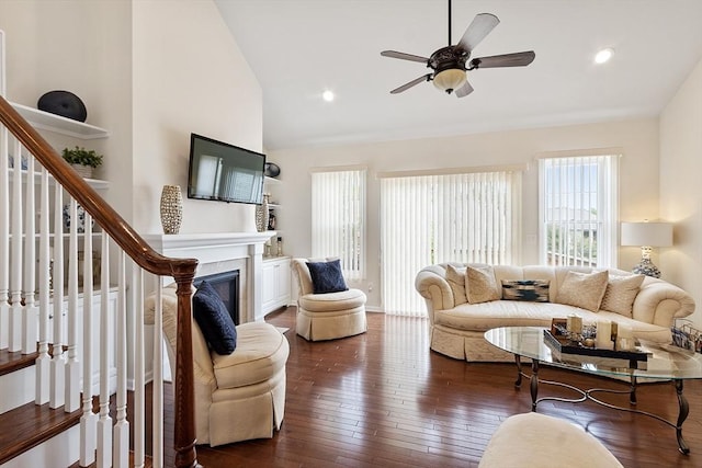 123 Skyline Dr Unit 123, Acton, MA 01720 - living room featuring lofted ceiling, ceiling fan, stairs, wood-type flooring, and a glass covered fireplace