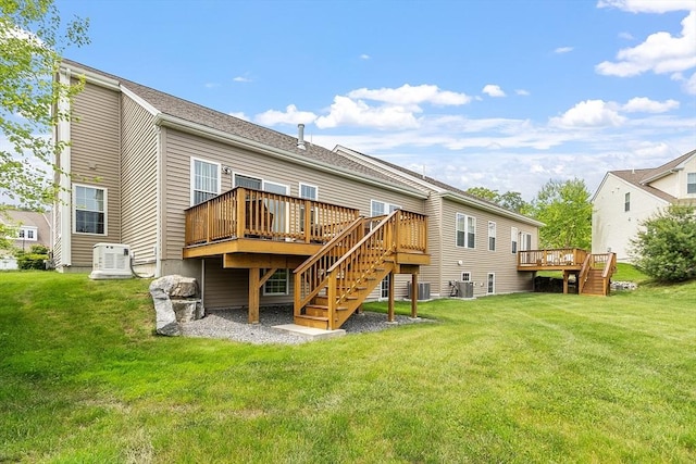 123 Skyline Dr Unit 123, Acton, MA 01720 - back of property featuring stairs, a deck, cooling unit, and a yard