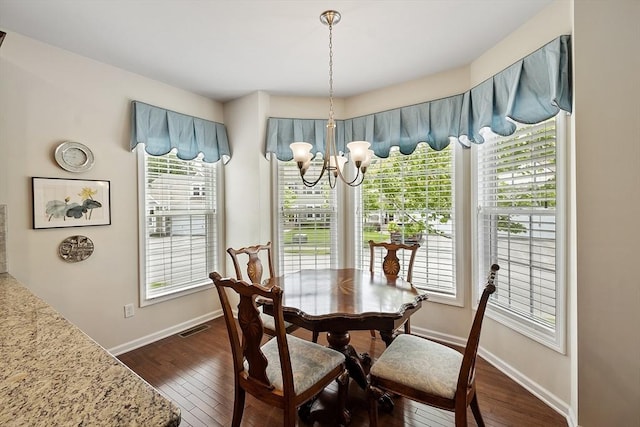123 Skyline Dr Unit 123, Acton, MA 01720 - dining space featuring a chandelier, dark wood-style floors, and baseboards