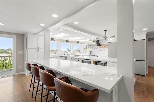 21 Glenley Ter, Boston, MA 02135 - kitchen featuring white fridge, wood finished floors, recessed lighting, white cabinetry, and dishwasher