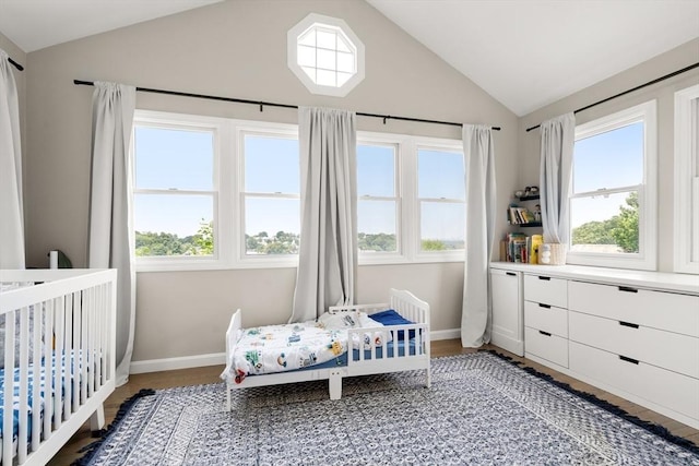 21 Glenley Ter, Boston, MA 02135 - bedroom with lofted ceiling, multiple windows, and light wood-style floors