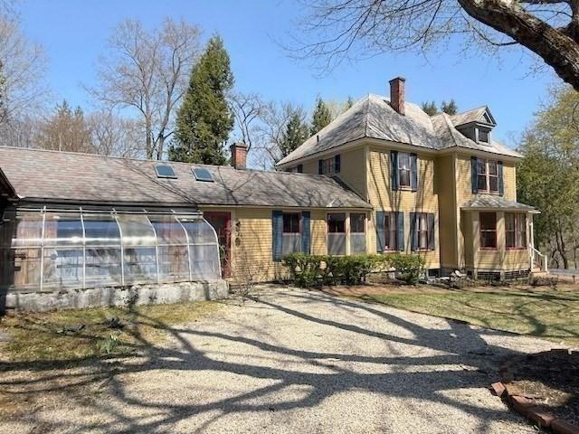 41 Bulkley, Williamstown, MA 01267 - view of front of home featuring a greenhouse, a chimney, and an outdoor structure