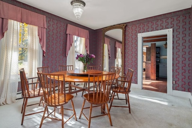 41 Bulkley, Williamstown, MA 01267 - dining space featuring wallpapered walls, healthy amount of natural light, light colored carpet, and arched walkways