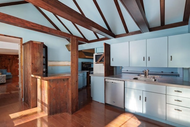 41 Bulkley, Williamstown, MA 01267 - kitchen with stainless steel dishwasher, a sink, wood finished floors, white cabinetry, and beam ceiling