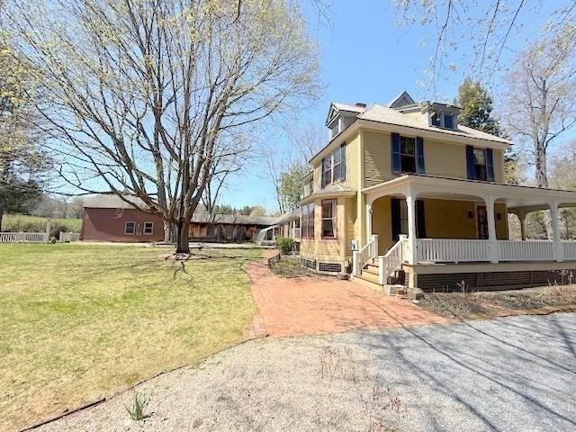 41 Bulkley, Williamstown, MA 01267 - view of front of home with covered porch and a front lawn