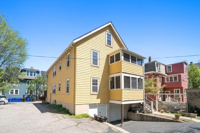 view of property exterior featuring a garage