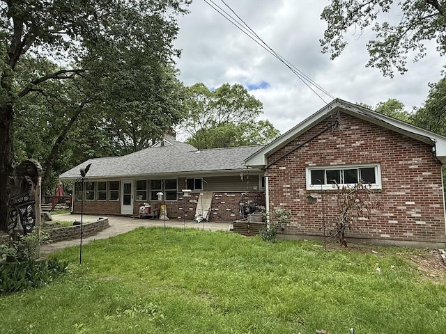 166 Fairview Ave, Rehoboth, MA 02769 - rear view of house featuring brick siding, a yard, a patio area, and a chimney