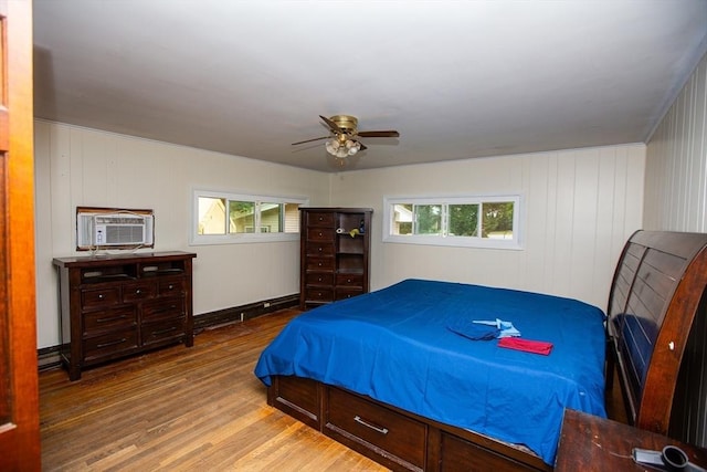 166 Fairview Ave, Rehoboth, MA 02769 - bedroom with wood finished floors, a ceiling fan, and a wall mounted AC