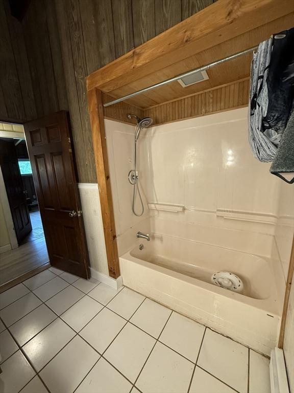 166 Fairview Ave, Rehoboth, MA 02769 - full bathroom featuring tile patterned floors, shower / tub combination, wooden walls, and baseboards