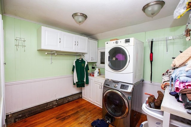 166 Fairview Ave, Rehoboth, MA 02769 - washroom featuring stacked washer / drying machine, cabinet space, and dark wood-type flooring