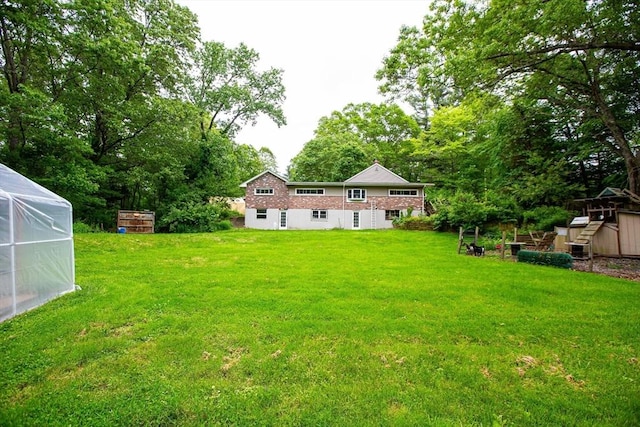 166 Fairview Ave, Rehoboth, MA 02769 - view of grassy yard featuring view of wooded area and an outdoor structure