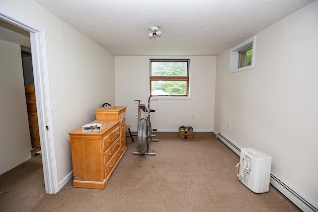 166 Fairview Ave, Rehoboth, MA 02769 - exercise area featuring a baseboard heating unit, light carpet, and baseboards