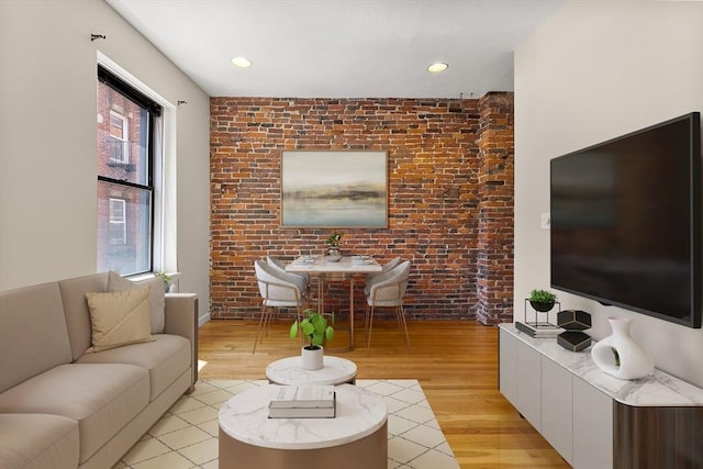 16 Foster St Unit 5, Boston, MA 02109 - living room with light wood-style flooring, brick wall, and recessed lighting