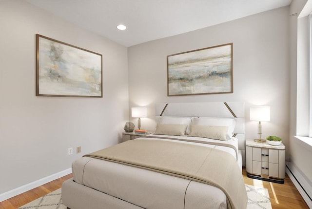 16 Foster St Unit 5, Boston, MA 02109 - bedroom with baseboard heating, light wood finished floors, and recessed lighting