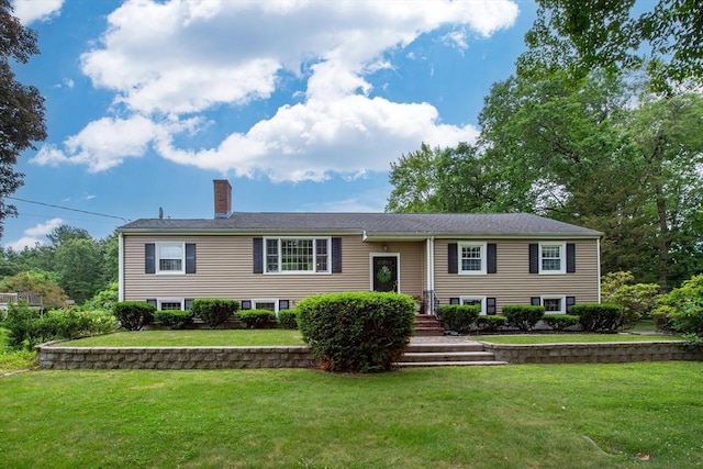 7 Perkins Row, Topsfield, MA 01983 - split foyer home with a chimney and a front yard