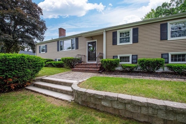 7 Perkins Row, Topsfield, MA 01983 - bi-level home featuring a chimney and a front lawn