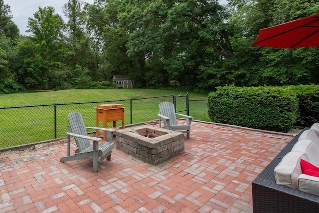 7 Perkins Row, Topsfield, MA 01983 - view of patio with an outdoor fire pit and a storage unit