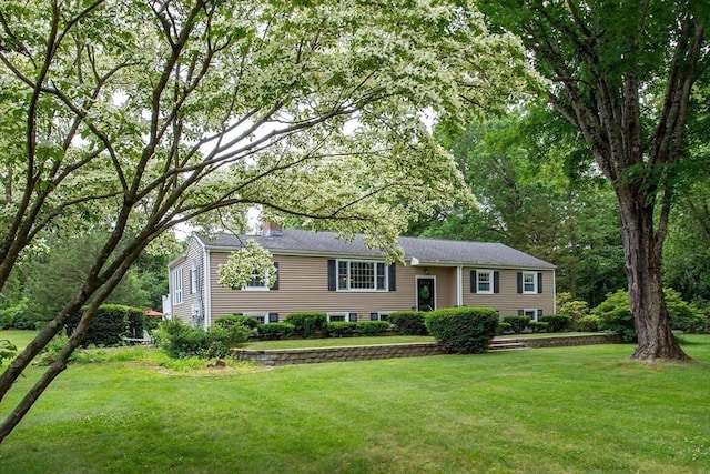 7 Perkins Row, Topsfield, MA 01983 - bi-level home with a front lawn and a chimney