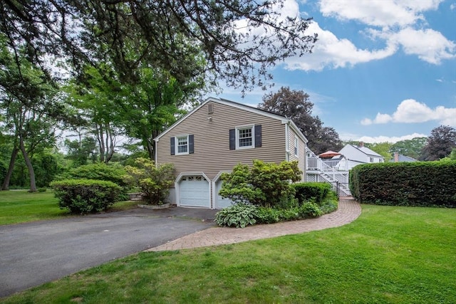 7 Perkins Row, Topsfield, MA 01983 - view of home's exterior with driveway, stairway, an attached garage, and a lawn