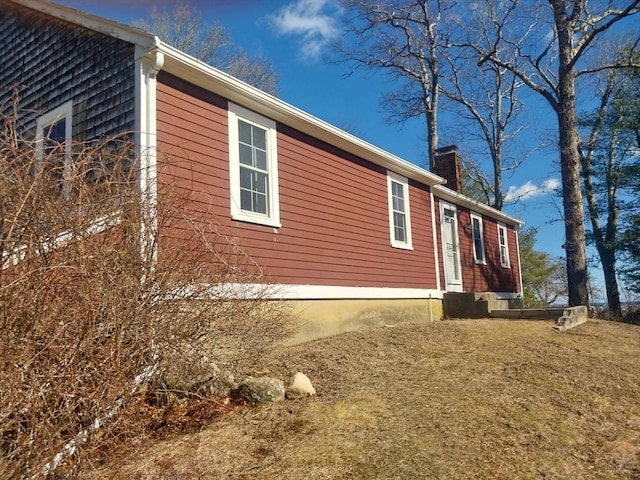 view of side of property with a chimney