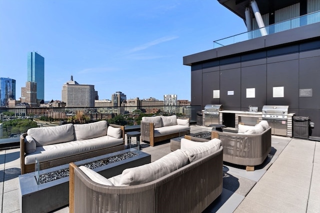 view of patio / terrace with grilling area, an outdoor kitchen, and an outdoor living space