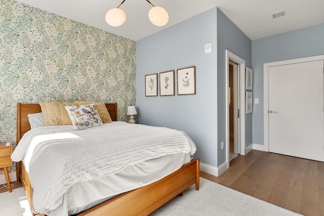 bedroom featuring hardwood / wood-style flooring