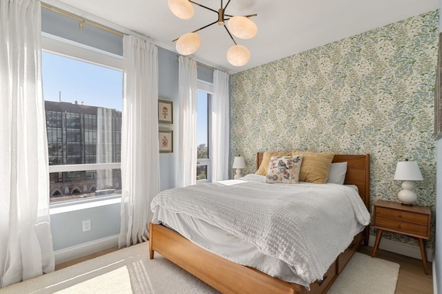 bedroom with a notable chandelier