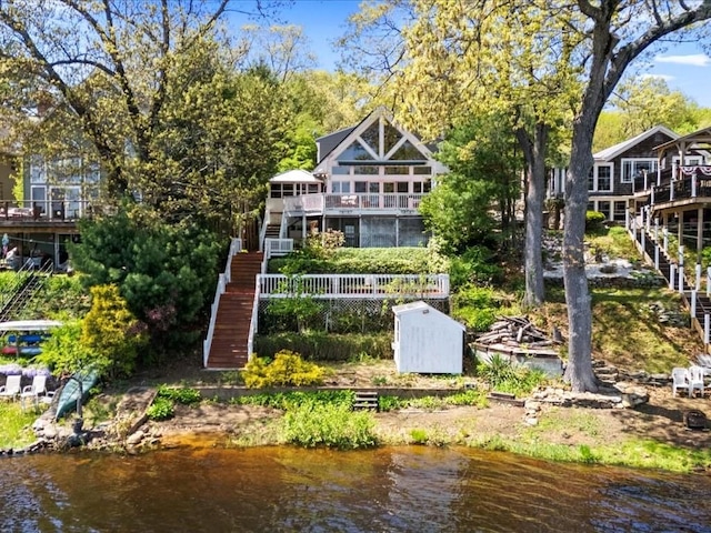 91 Lake Shore Dr, West Brookfield, MA 01585 - rear view of house with stairs and a water view