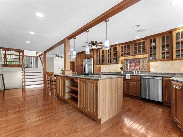 91 Lake Shore Dr, West Brookfield, MA 01585 - kitchen with appliances with stainless steel finishes, hardwood / wood-style flooring, ceiling fan, brown cabinetry, and recessed lighting