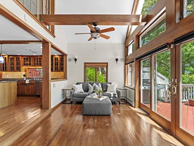 91 Lake Shore Dr, West Brookfield, MA 01585 - living area with hardwood / wood-style floors, plenty of natural light, beamed ceiling, a ceiling fan, and a high ceiling