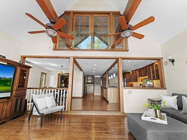 91 Lake Shore Dr, West Brookfield, MA 01585 - living area featuring ceiling fan, high vaulted ceiling, wood finished floors, and a chandelier