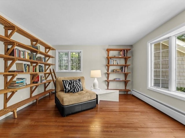 91 Lake Shore Dr, West Brookfield, MA 01585 - sitting room with a baseboard radiator, plenty of natural light, and wood finished floors