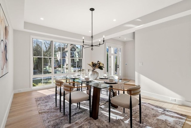 dining room featuring a chandelier and light hardwood / wood-style floors