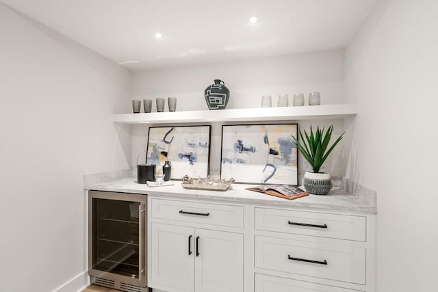 bar featuring white cabinetry and wine cooler