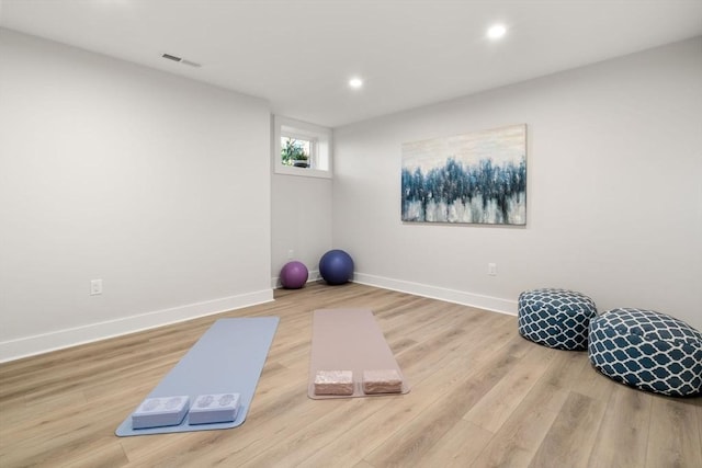 workout area featuring light hardwood / wood-style flooring