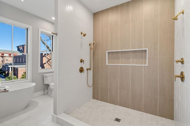 bathroom with toilet and separate shower and tub