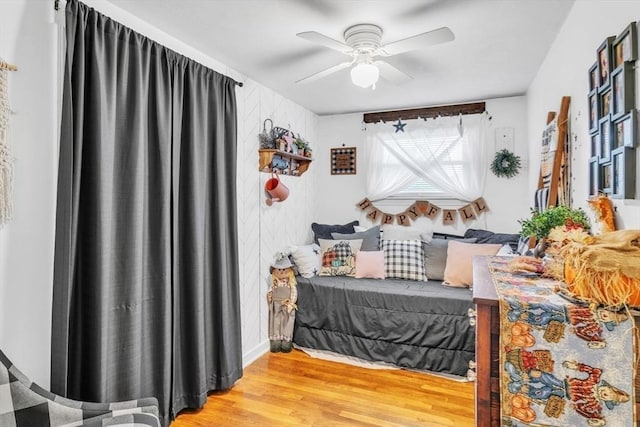 bedroom featuring ceiling fan and wood finished floors