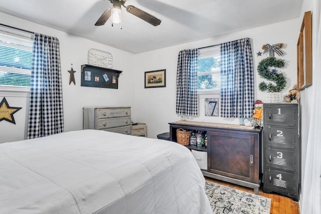 bedroom featuring light wood-style flooring and a ceiling fan