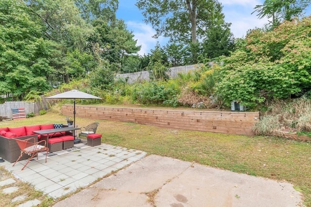 view of patio / terrace featuring a fenced backyard and an outdoor living space