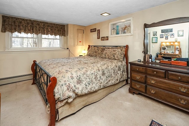 bedroom with light colored carpet and a baseboard heating unit