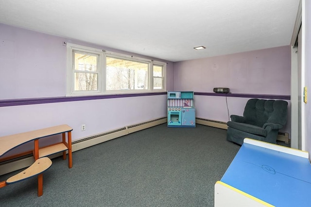 sitting room featuring baseboard heating